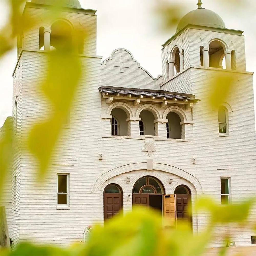 The Chapel seen through the surrounding grape vines.