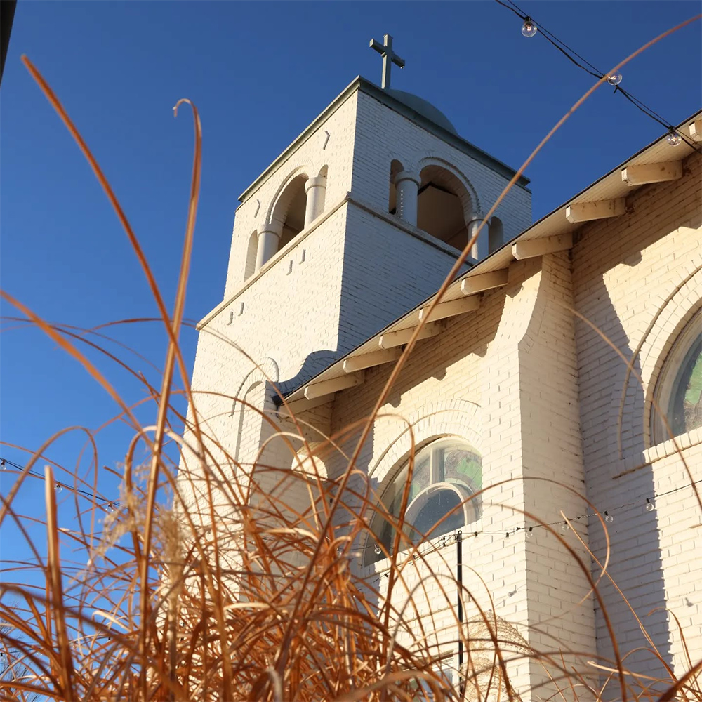Looking up at the Chapel from the long grasses outside