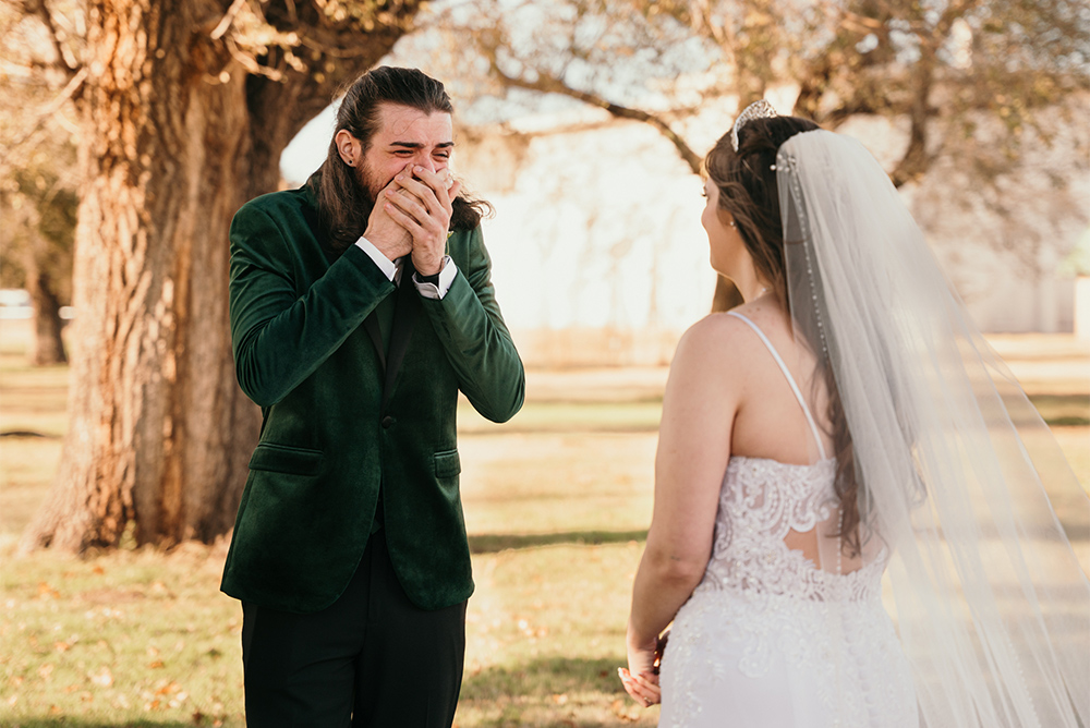 A groom has his breath taken away as he sees his bride